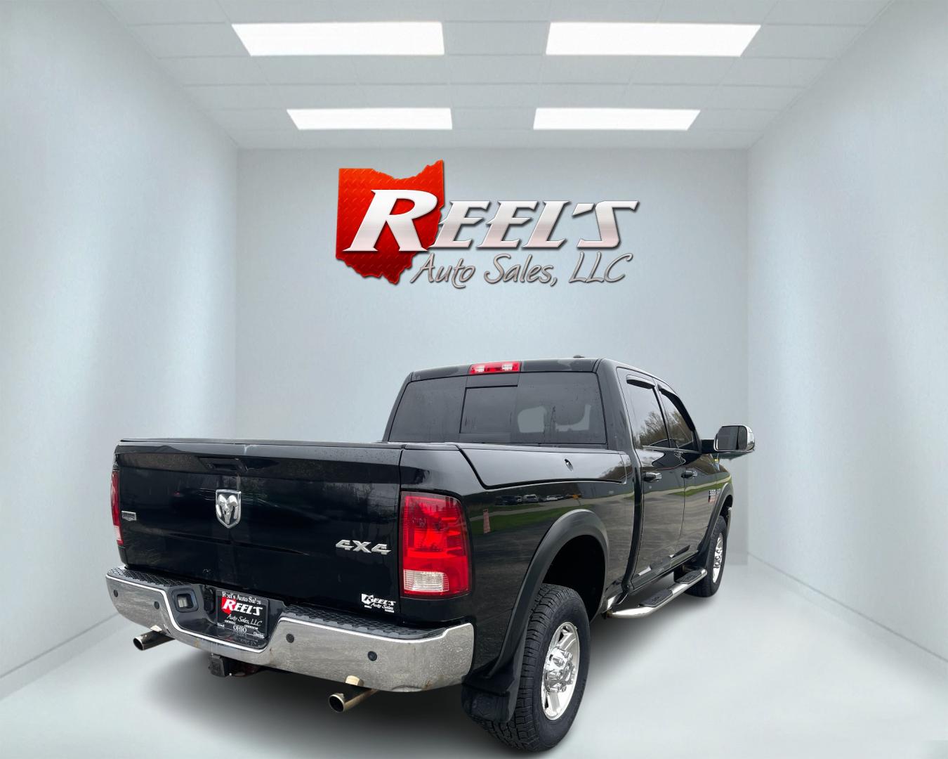 2012 Black /Black Dodge Ram 2500 Laramie Crew Cab SWB 4WD (3C6TD5FT6CG) with an 5.7L V8 OHV 16V engine, 6-Speed Automatic transmission, located at 547 E. Main St., Orwell, OH, 44076, (440) 437-5893, 41.535435, -80.847855 - This 2012 Dodge Ram 2500 Laramie Crew Cab is a heavy-duty pickup truck designed for serious towing and hauling capabilities. Powered by a 5.7L HEMI V8 engine mated to a 6-speed automatic transmission and 3.73 gearing, it boasts an impressive 10,550-pound towing capacity. The interior is well-appoint - Photo#5